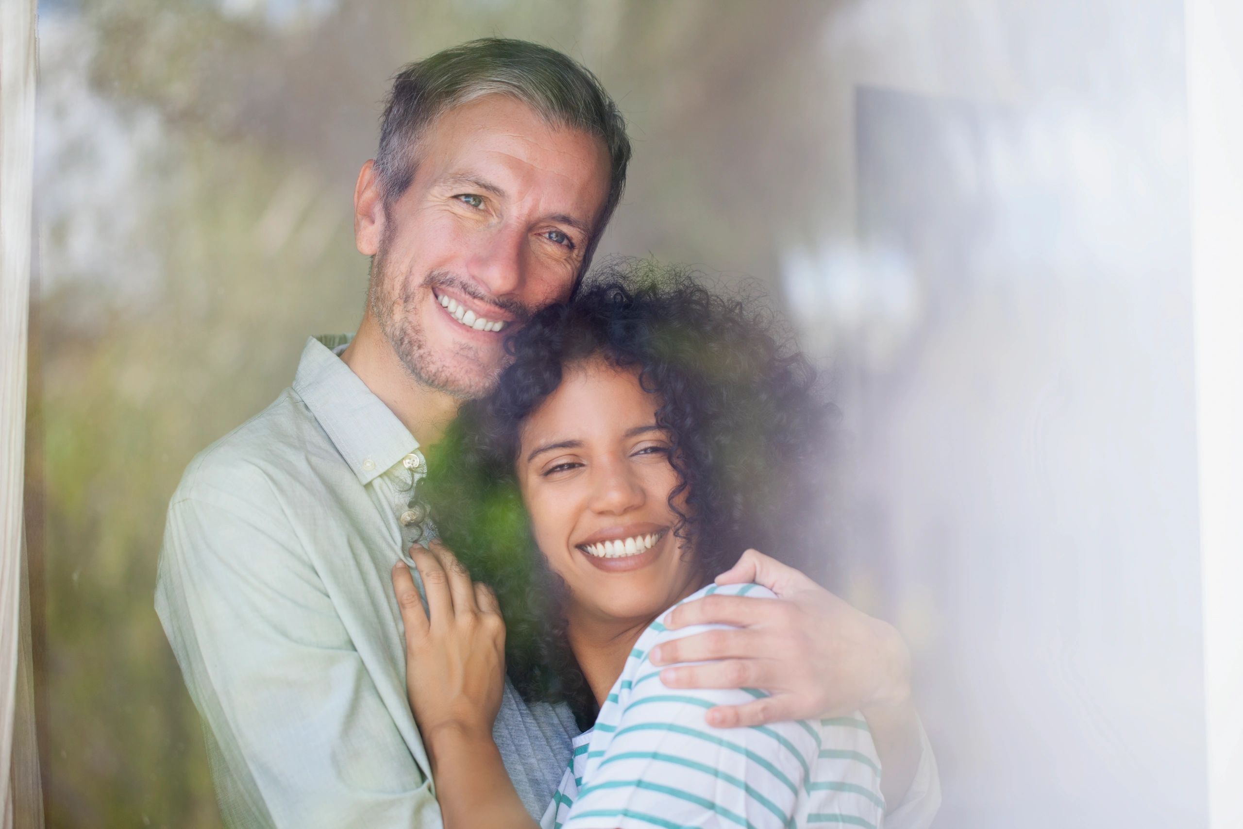 Diverse couple in their 30s and 40s sharing a calm, supportive moment