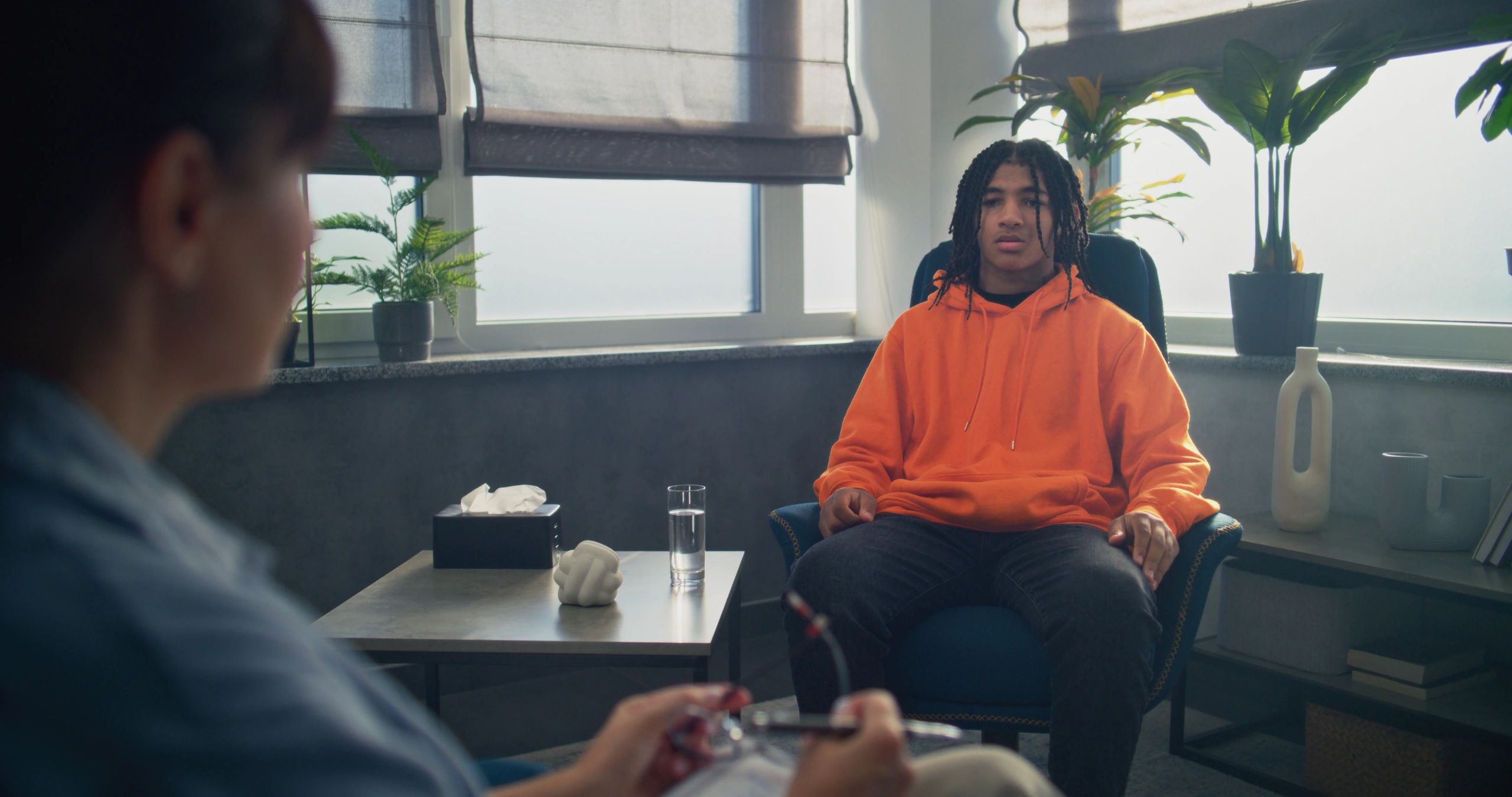 Psychologist providing therapy for a teenager