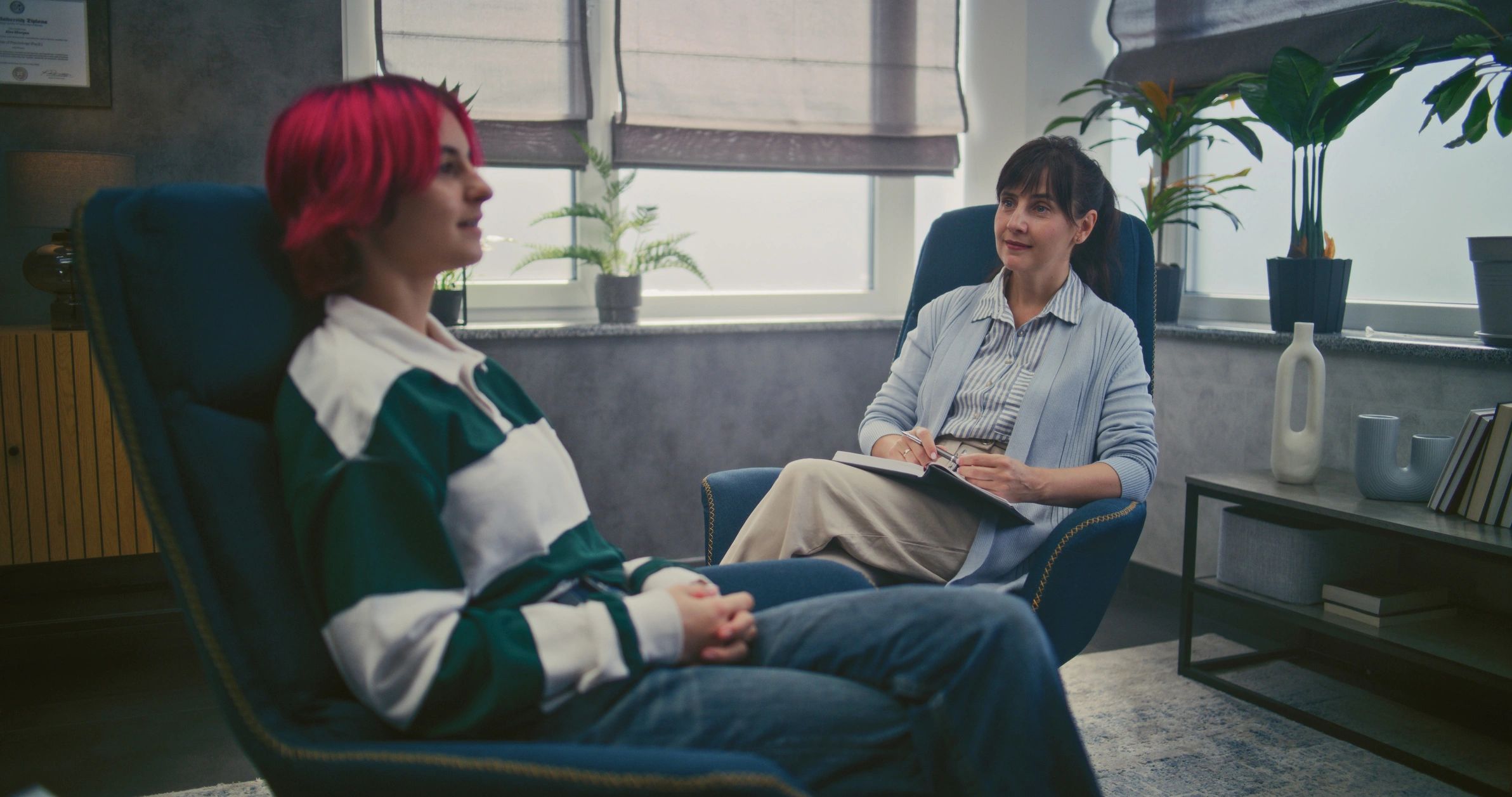 Teen therapy session with psychotherapist helping a girl find solutions